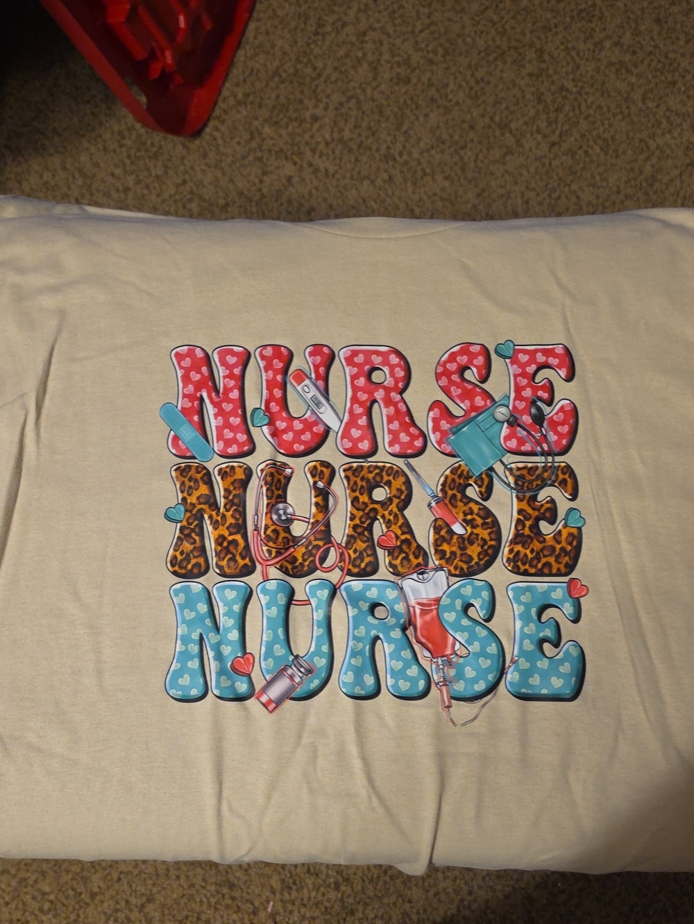 Gildan Beige Short Sleeve Tee with Colorful "NURSE" Graphic